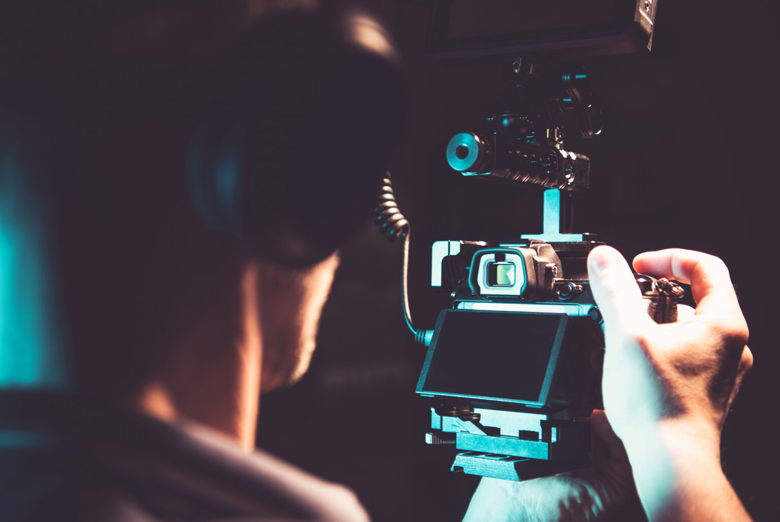 Filmmaker taking handheld shots with a DSLR camera