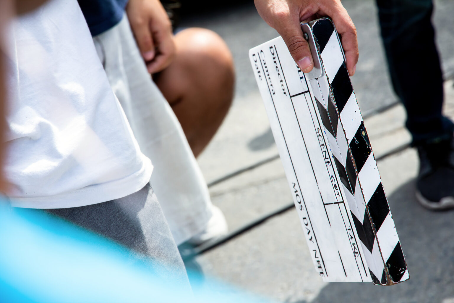 Camera team working behind the scenes on a film set